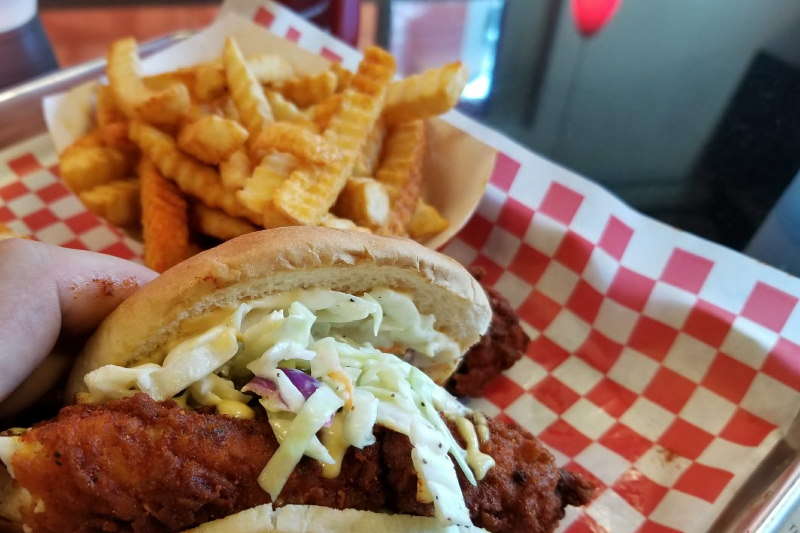 Chicken Slider with fries and coleslaw inside a food basket